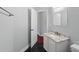 Bathroom featuring a modern vanity with marble countertop and black tile floors at 1851 Sweetwater West Cir, Apopka, FL 32712