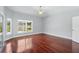 Bedroom with wood floors, large windows and natural light at 1851 Sweetwater West Cir, Apopka, FL 32712