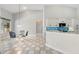 Bright breakfast nook with views of pool and white tile floors at 1851 Sweetwater West Cir, Apopka, FL 32712
