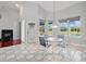Dining area with view of pool and access to lanai, adjacent to Gathering room at 1851 Sweetwater West Cir, Apopka, FL 32712