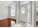 Elegant entryway with marble flooring, decorative door, and lots of natural light at 1851 Sweetwater West Cir, Apopka, FL 32712