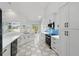 Bright kitchen featuring white cabinets, stainless steel appliances, and ample counter space at 1851 Sweetwater West Cir, Apopka, FL 32712