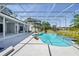 A gorgeous pool with a screened in patio and a beautiful outdoor view at 1851 Sweetwater West Cir, Apopka, FL 32712