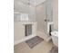 Modern bathroom featuring a tiled shower, separate soaking tub, and elegant fixtures at 19334 Banfield Pl, Orlando, FL 32827