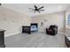 bedroom featuring a ceiling fan, modern flooring, and accent decor at 19334 Banfield Pl, Orlando, FL 32827