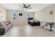 Spacious bedroom with modern flooring, windows and comfortable seating area at 19334 Banfield Pl, Orlando, FL 32827
