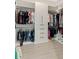 Walk-in closet with organized shelving and ample hanging space at 19334 Banfield Pl, Orlando, FL 32827