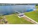 Lakeside gazebo and dock provide a serene escape amidst lush greenery and a calm lake at 19334 Banfield Pl, Orlando, FL 32827