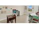 Homeschool room features a large desk, whiteboard, and plenty of natural light at 19334 Banfield Pl, Orlando, FL 32827