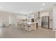 Spacious, bright kitchen features a large center island, stainless steel appliances, and ample cabinet space at 19334 Banfield Pl, Orlando, FL 32827