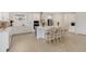 Bright kitchen boasts a large island with seating, white cabinetry, and stainless steel appliances at 19334 Banfield Pl, Orlando, FL 32827