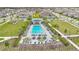 Community pool and lounge area, nestled among palm trees, featuring a pergola and plenty of space to relax at 19334 Banfield Pl, Orlando, FL 32827