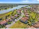 An aerial view shows the beautiful community, waterfront view, and location of this home at 1945 Via Lago Dr, Lakeland, FL 33810
