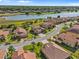 An aerial view shows the beautiful community, waterfront view, and location of this home at 1945 Via Lago Dr, Lakeland, FL 33810