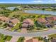 An aerial view shows the beautiful community, waterfront view, and location of this home at 1945 Via Lago Dr, Lakeland, FL 33810