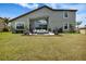 Lush backyard with a patio seating area, perfect for outdoor relaxation and entertainment at 1945 Via Lago Dr, Lakeland, FL 33810