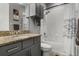 Bathroom with a granite countertop, shower-tub combo and nice vanity storage space at 1945 Via Lago Dr, Lakeland, FL 33810