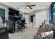 Bedroom featuring gray carpet, ceiling fan, soundproofing and a desk space at 1945 Via Lago Dr, Lakeland, FL 33810