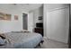 This bedroom has carpet, a dresser, TV, and a ceiling fan plus lots of closet space at 1945 Via Lago Dr, Lakeland, FL 33810