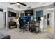 Bedroom featuring gray carpet, ceiling fan, soundproofing, dual monitors and a desk space at 1945 Via Lago Dr, Lakeland, FL 33810