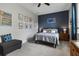 Relaxing bedroom with a comfortable bed, accent wall, and thoughtful decorative touches at 1945 Via Lago Dr, Lakeland, FL 33810