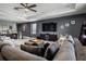 Spacious Gathering room with large sectional sofa, modern television, and comfortable seating at 1945 Via Lago Dr, Lakeland, FL 33810