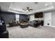 Spacious bonus room with comfortable sectional sofa, wet bar, and modern lighting at 1945 Via Lago Dr, Lakeland, FL 33810
