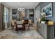 Elegant dining room with modern chandelier, gray walls, and stylish decor at 1945 Via Lago Dr, Lakeland, FL 33810