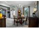 Elegant dining room with a modern chandelier, and light-filled space at 1945 Via Lago Dr, Lakeland, FL 33810