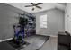 Exercise room with storage shelving and rubber flooring for workouts at 1945 Via Lago Dr, Lakeland, FL 33810