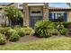 Close up of front entrance with manicured landscaping and double door entry at 1945 Via Lago Dr, Lakeland, FL 33810