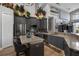 Modern kitchen with stainless steel appliances, ample counter space, and stylish gray cabinetry at 1945 Via Lago Dr, Lakeland, FL 33810