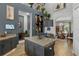 Modern kitchen boasts a spacious island, granite countertops, and sleek gray cabinetry at 1945 Via Lago Dr, Lakeland, FL 33810