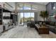 Bright living room with large windows, comfortable seating, and a view of the outdoors at 1945 Via Lago Dr, Lakeland, FL 33810