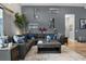 Comfortable living room featuring a large sectional sofa, stylish decor, and neutral color palette at 1945 Via Lago Dr, Lakeland, FL 33810