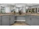 Bright main bathroom with dual sinks, granite counters, and separate shower and toilet rooms at 1945 Via Lago Dr, Lakeland, FL 33810