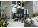 Outdoor patio with a table and six chairs, with beautiful plant decor at 1945 Via Lago Dr, Lakeland, FL 33810