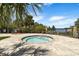 Inviting community spa with a clear view of the adjacent lake, offering a relaxing oasis for residents at 1945 Via Lago Dr, Lakeland, FL 33810