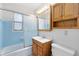 Cozy bathroom featuring a shower and vanity with storage at 226 S Apollo Dr, Apopka, FL 32703