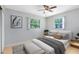 Bright bedroom featuring a cozy bed, natural light, and stylish decor at 226 S Apollo Dr, Apopka, FL 32703