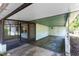 Attached carport features door and view of the screened porch at 226 S Apollo Dr, Apopka, FL 32703