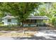 Modest single story home with fenced yard, mature tree and covered parking at 226 S Apollo Dr, Apopka, FL 32703