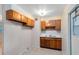 Compact kitchen featuring wood cabinets and laminate countertops at 226 S Apollo Dr, Apopka, FL 32703