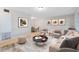 Cozy living area with a stylish rug, comfortable seating, and bright natural light at 226 S Apollo Dr, Apopka, FL 32703