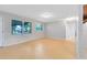 Neutral living room with hardwood floors, neutral walls and multiple windows at 226 S Apollo Dr, Apopka, FL 32703