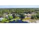 Breathtaking aerial view of the community showcasing lush greenery, a serene lake, and neighborhood layout at 228 Deleon Rd, Debary, FL 32713