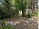 Backyard with storage shed and mature trees, providing shade and privacy at 228 Deleon Rd, Debary, FL 32713