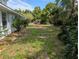Well maintained backyard with lush landscaping and brick path, perfect for outdoor enjoyment at 228 Deleon Rd, Debary, FL 32713