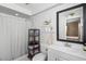 Updated bathroom with white shiplap, shower, and shelving for storage at 228 Deleon Rd, Debary, FL 32713