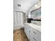 Bright bathroom featuring shower with tub, marble countertop, and modern fixtures at 228 Deleon Rd, Debary, FL 32713